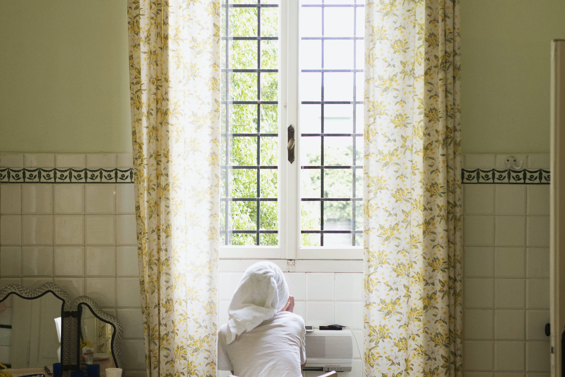 woman looking outside window